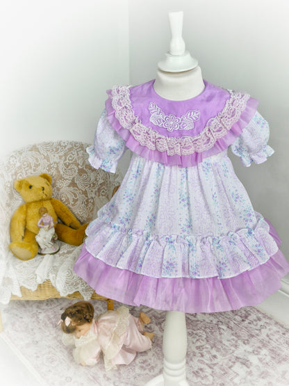 2-3 years. Lilac and white taffeta vintage dress with tiny blue flowers and lace details