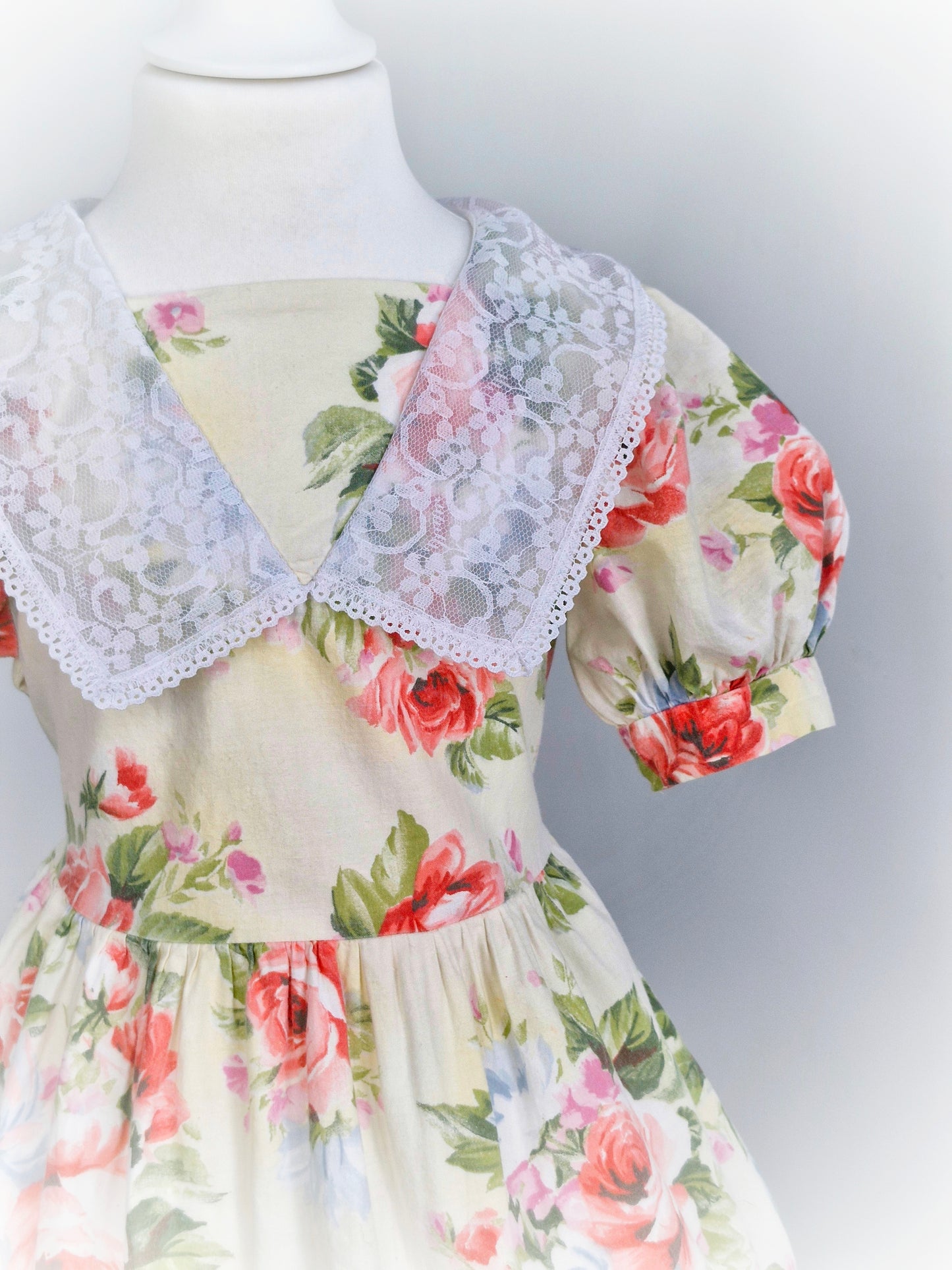 3 years. Cream floral.vintage dress by Sugar Plum, puff sleeves and white lace bib