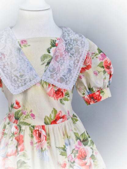 3 years. Cream floral.vintage dress by Sugar Plum, puff sleeves and white lace bib