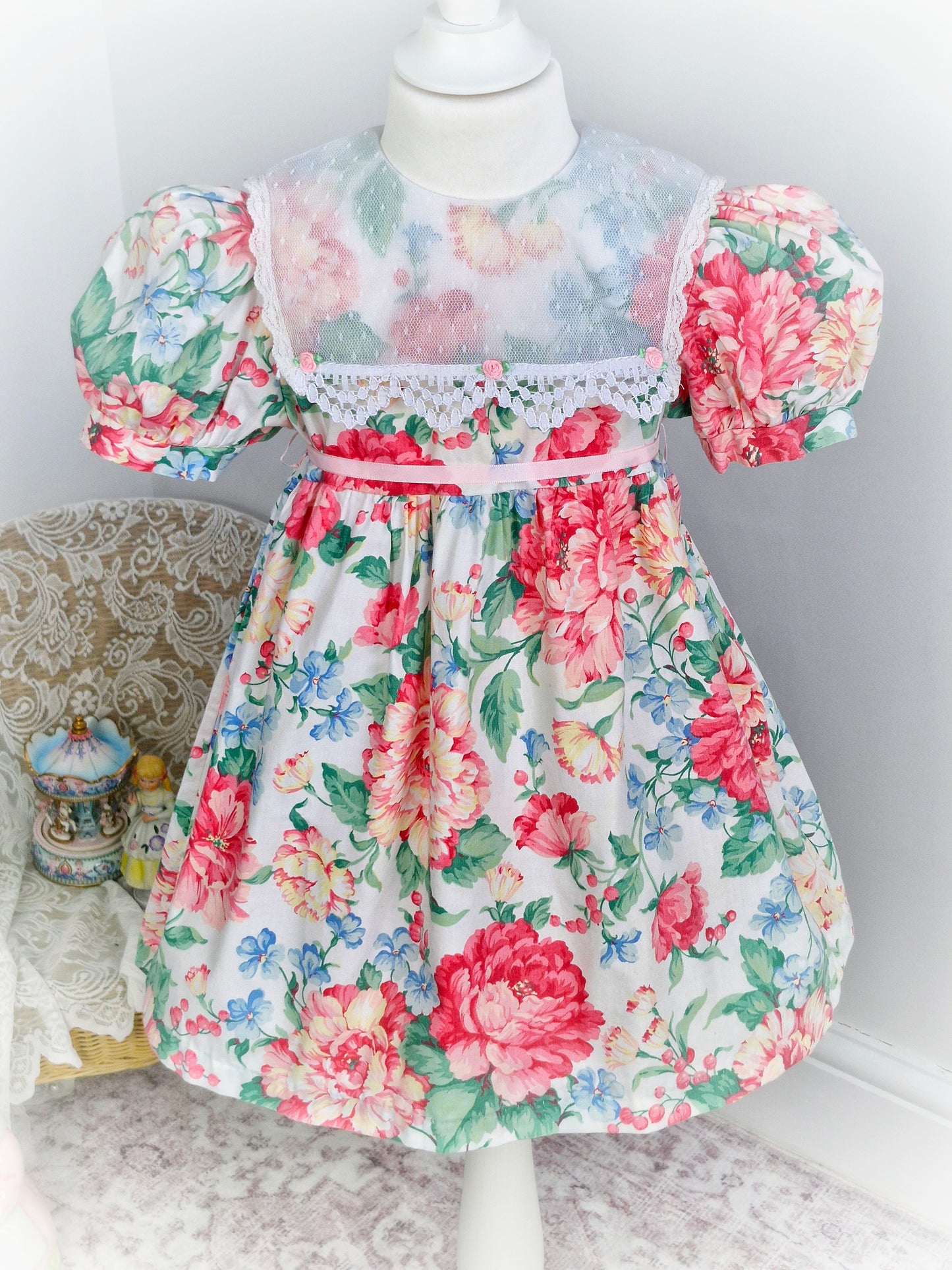 4 years. Vintage floral dress by La Princess, with white lace bib and bib ribbon