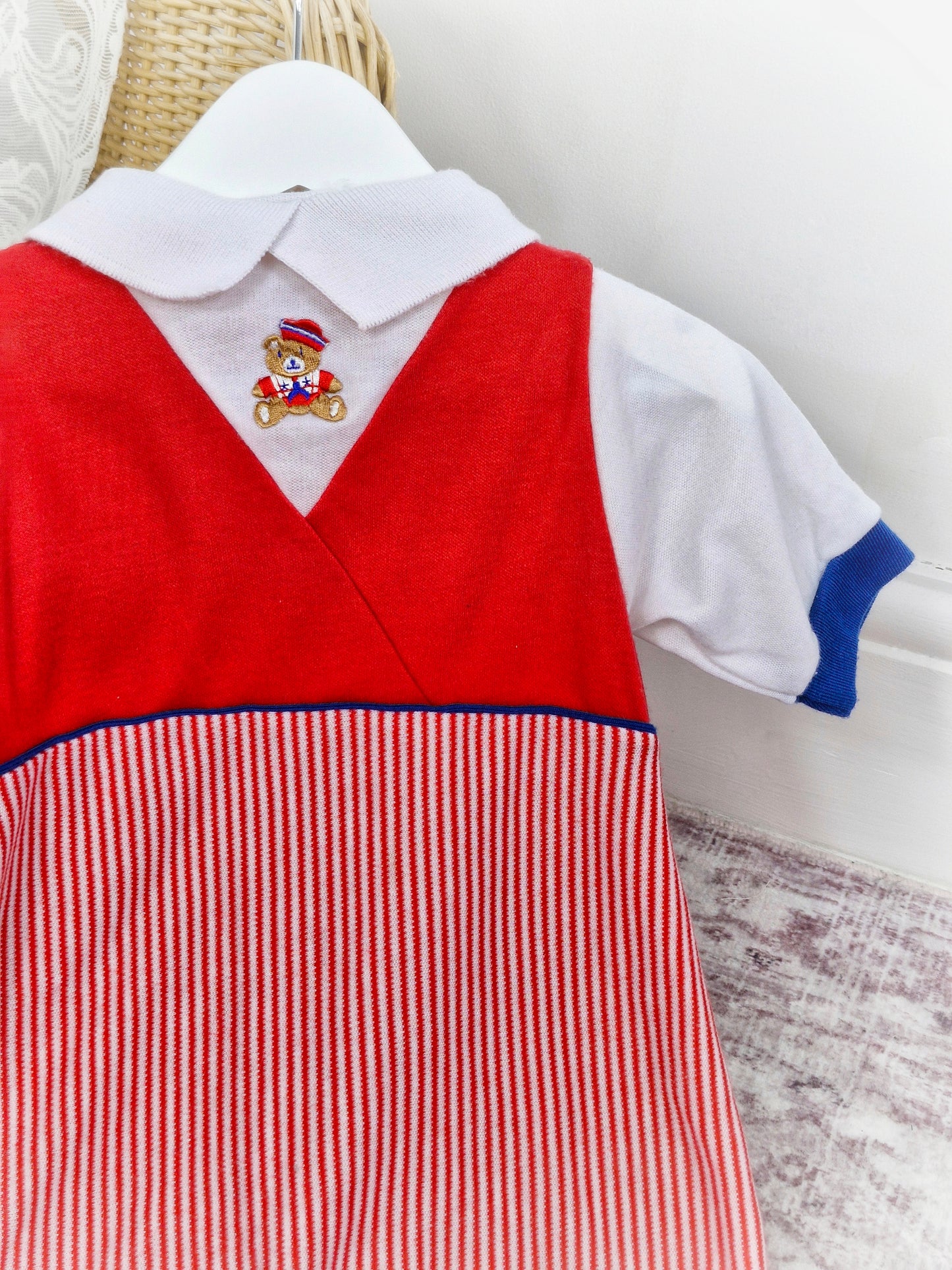 6-12 months. Red and white romper with navy details. Embroidered sailor bear