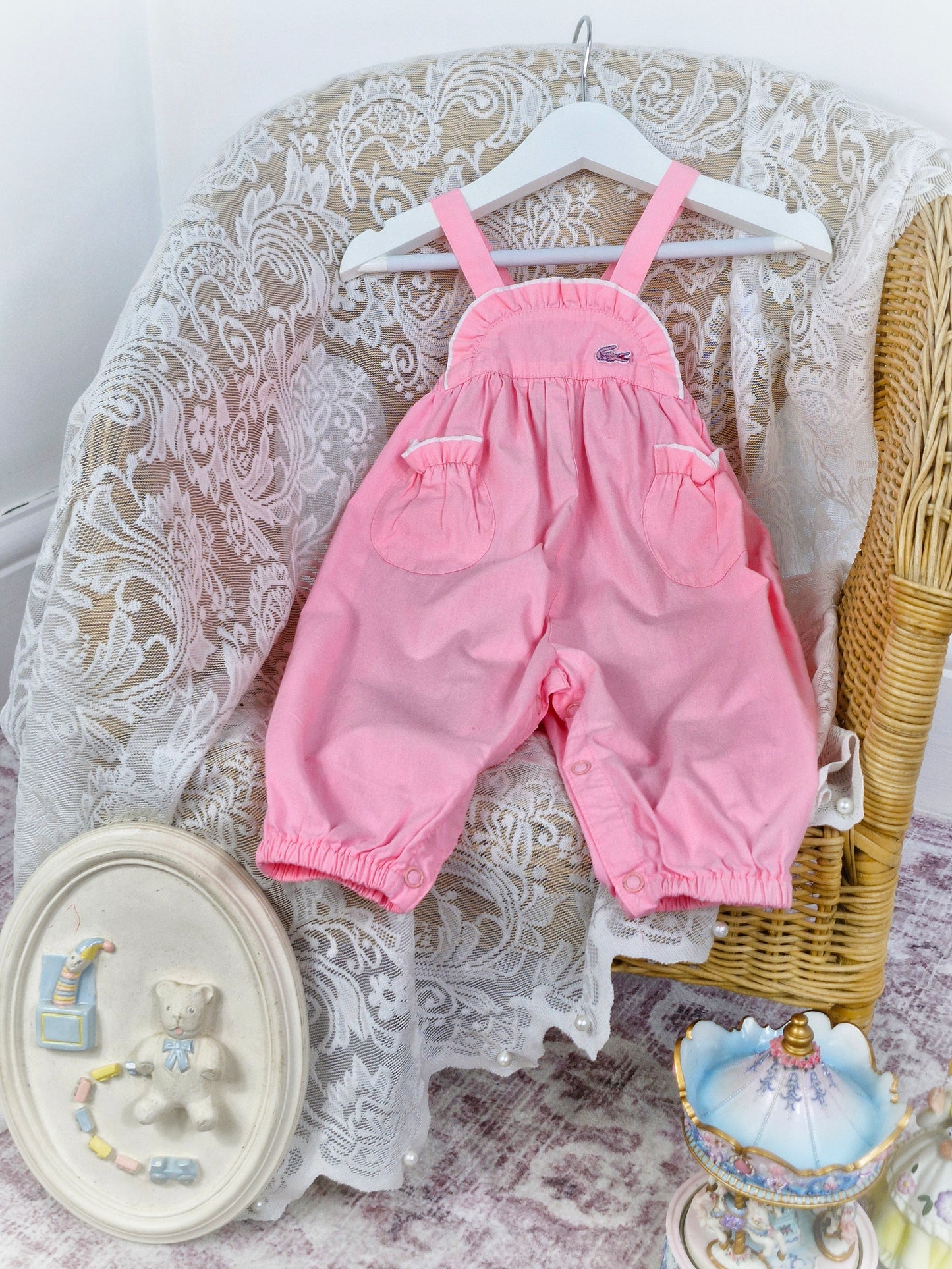 6-9 months. Pink vintage Lacoste dungarees with light frill