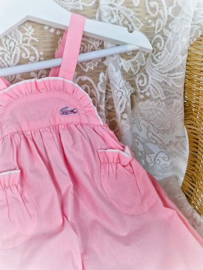 6-9 months. Pink vintage Lacoste dungarees with light frill