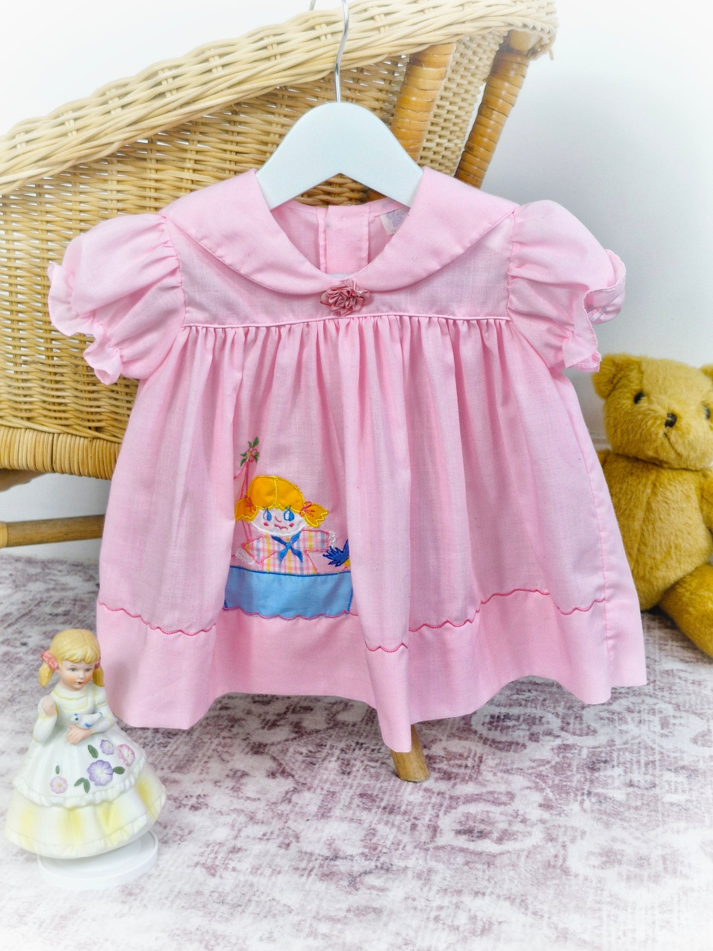 9-12 months. Sweet pink vintage dress with girl and bird in boat