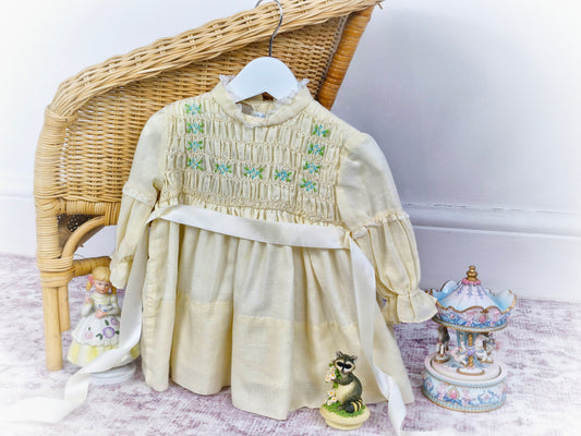 12-18 months. Cream vintage Polly Flinders smock dress