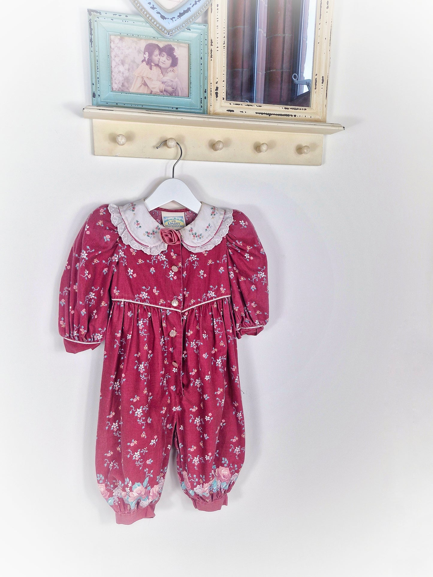 18 months. Vintage Daisy Kingdom romper, maroon with flowers, white collar and padded shoulders