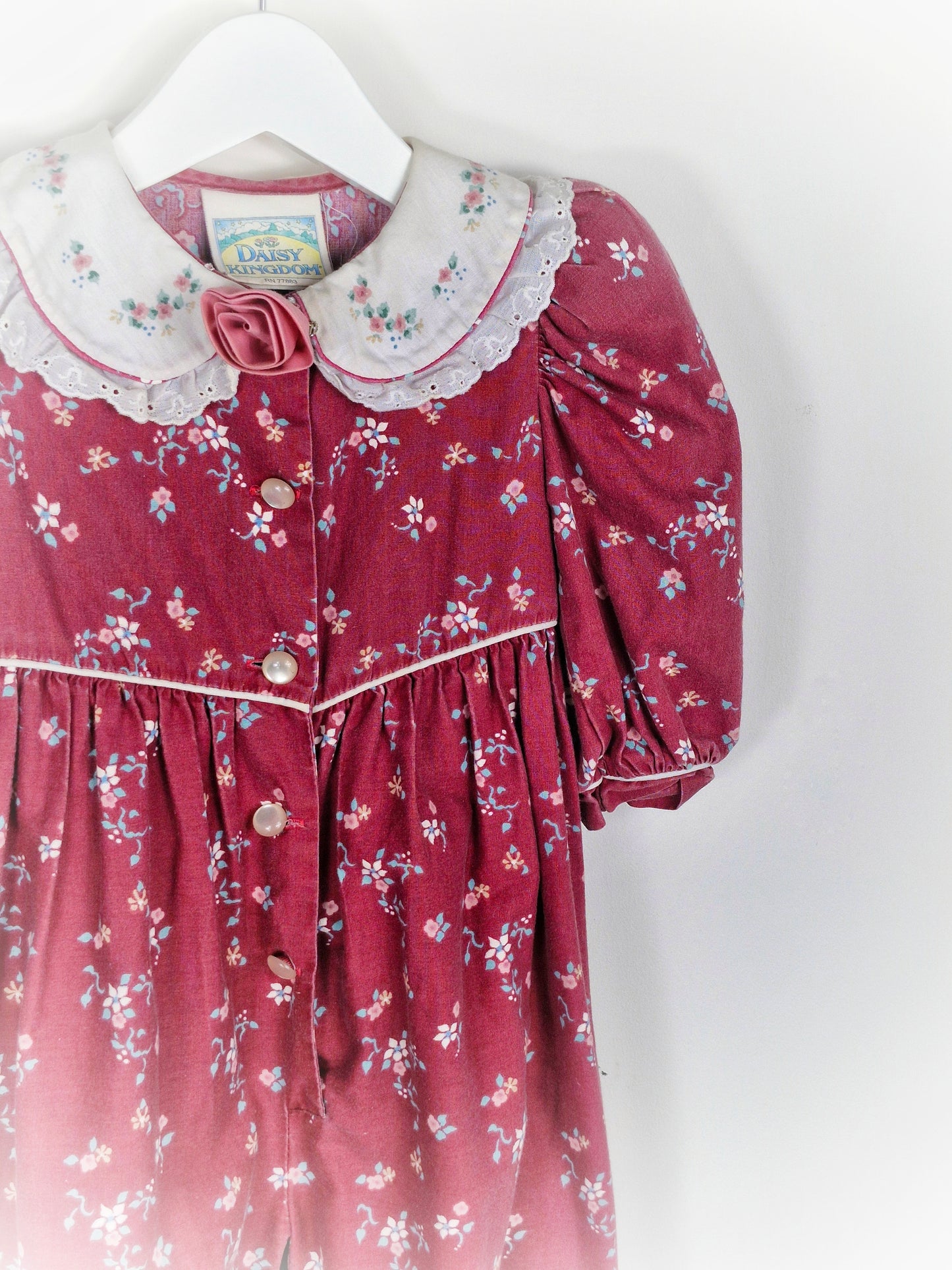 18 months. Vintage Daisy Kingdom romper, maroon with flowers, white collar and padded shoulders