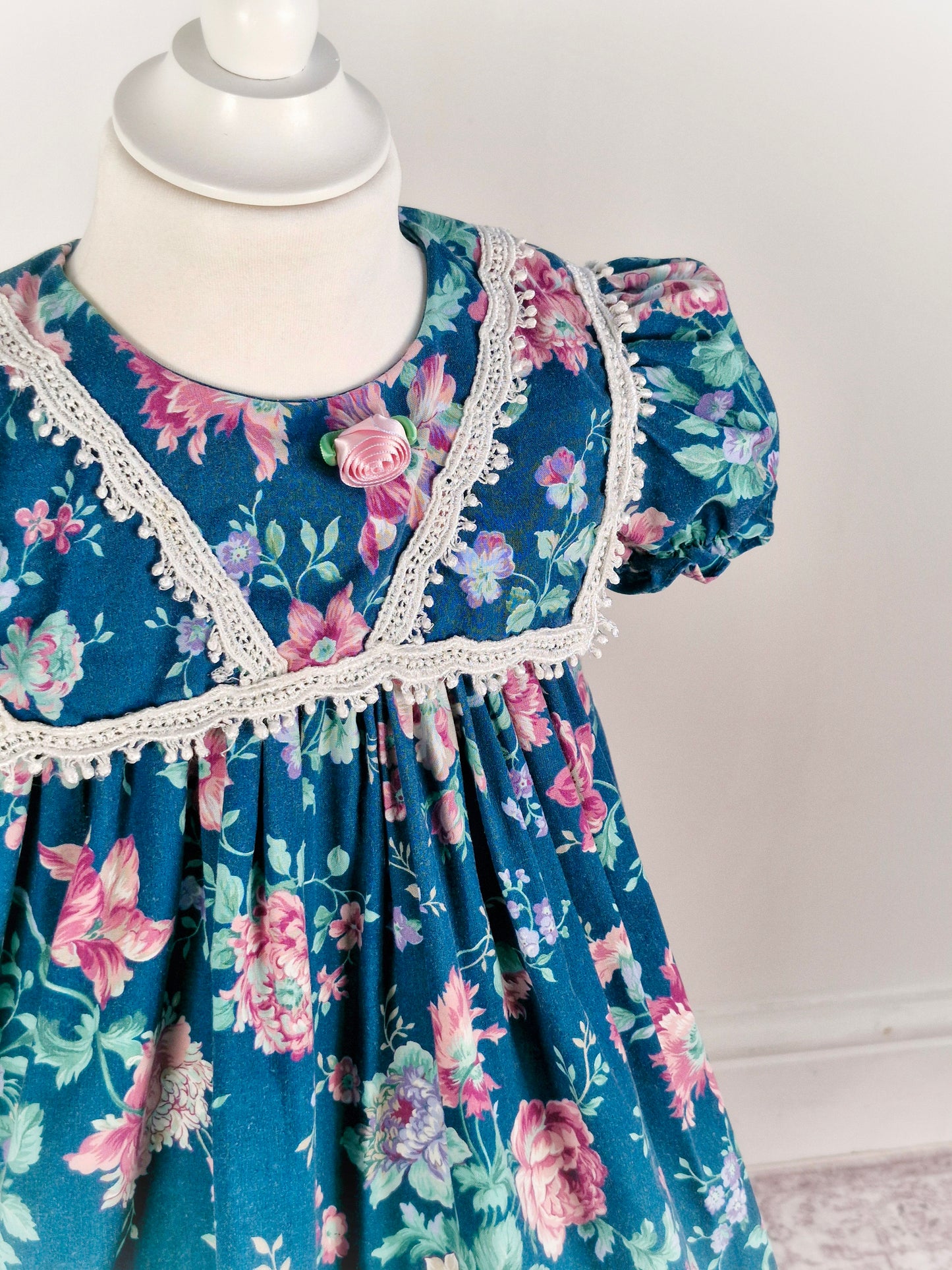 3 years. Teal vintage dress with pink flowers. Small fault*