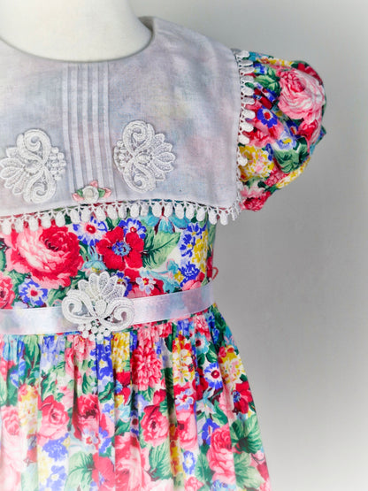 5-6 years. Vintage Rare Editions floral dress with white bib and ribbon