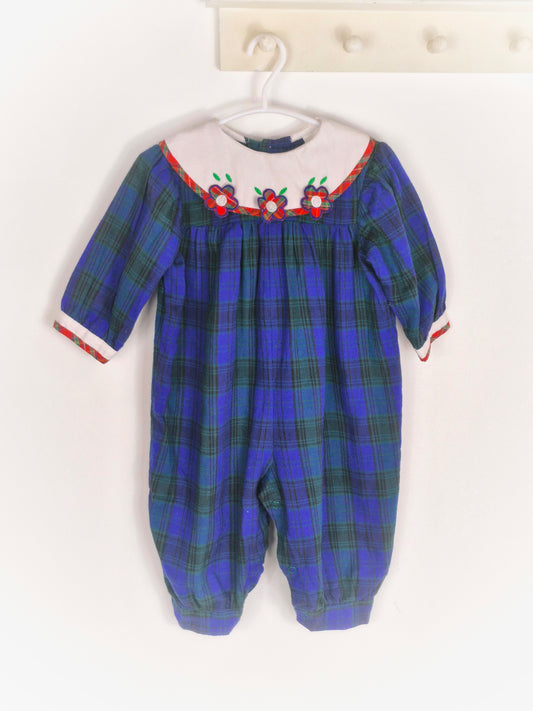 6-12 months. Navy and green tartan romper with white bib, red tartan flowers and trim