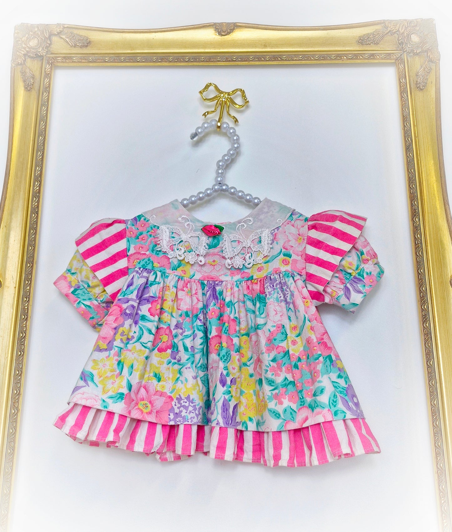 0-3 months. Bright floral vintage dress by Allison Ann.