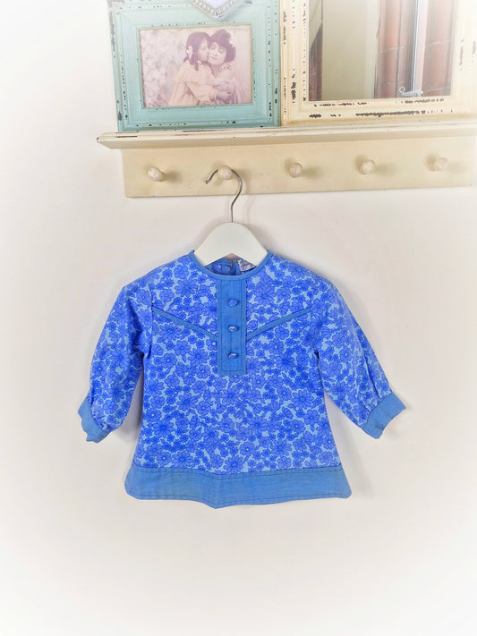 12-18 months as dress or 2-3 years as tunic. Blue vintage floral dress/tunic with long sleeves