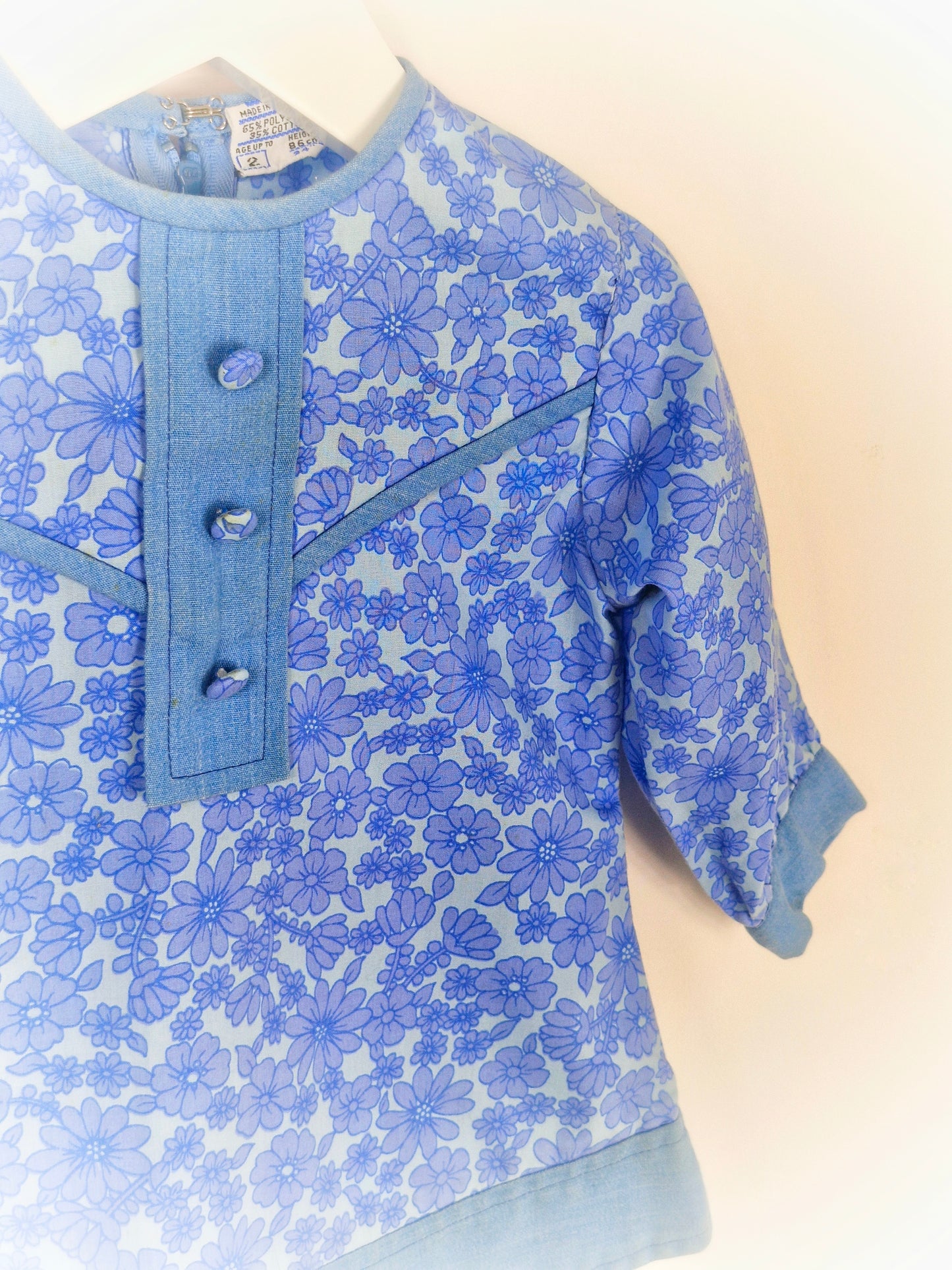 12-18 months as dress or 2-3 years as tunic. Blue vintage floral dress/tunic with long sleeves