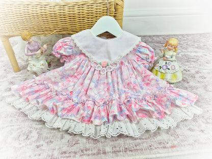 6-12 months. Vintage Little Gems. Pastel floral dress with white bib and pink rosette