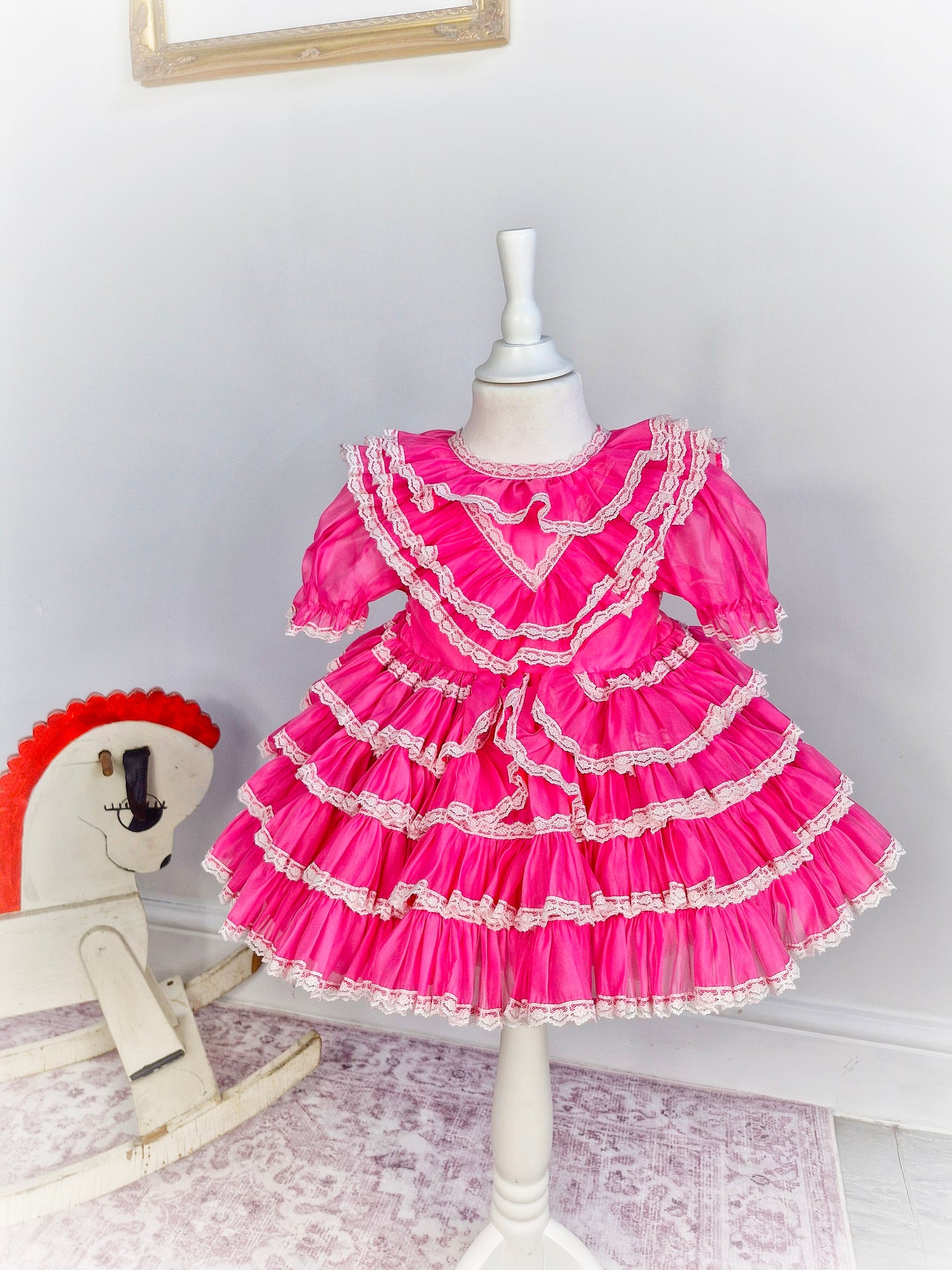 2 years. Hot pink vintage ruffle dress with white lace trim