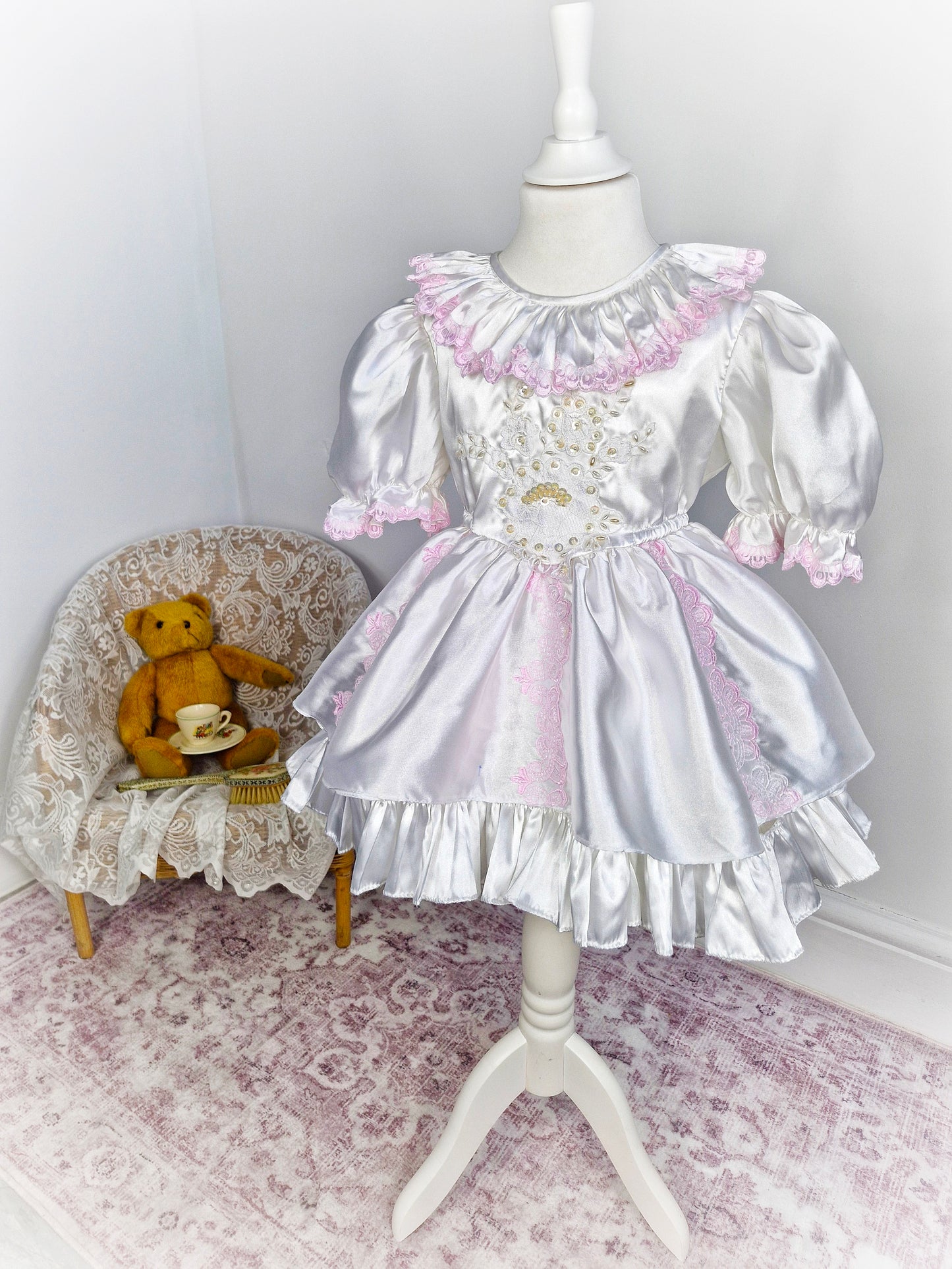 3 years. White satin vintage layered dress with pink lace and puff sleeves.