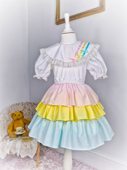 5 years. Vintage Kandy Ann, white dress with pastel coloured layers and ribbons