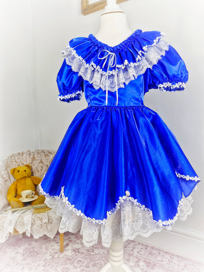 5-6 years. Royal blue vintage gown with white lace details and Ruffles at the back