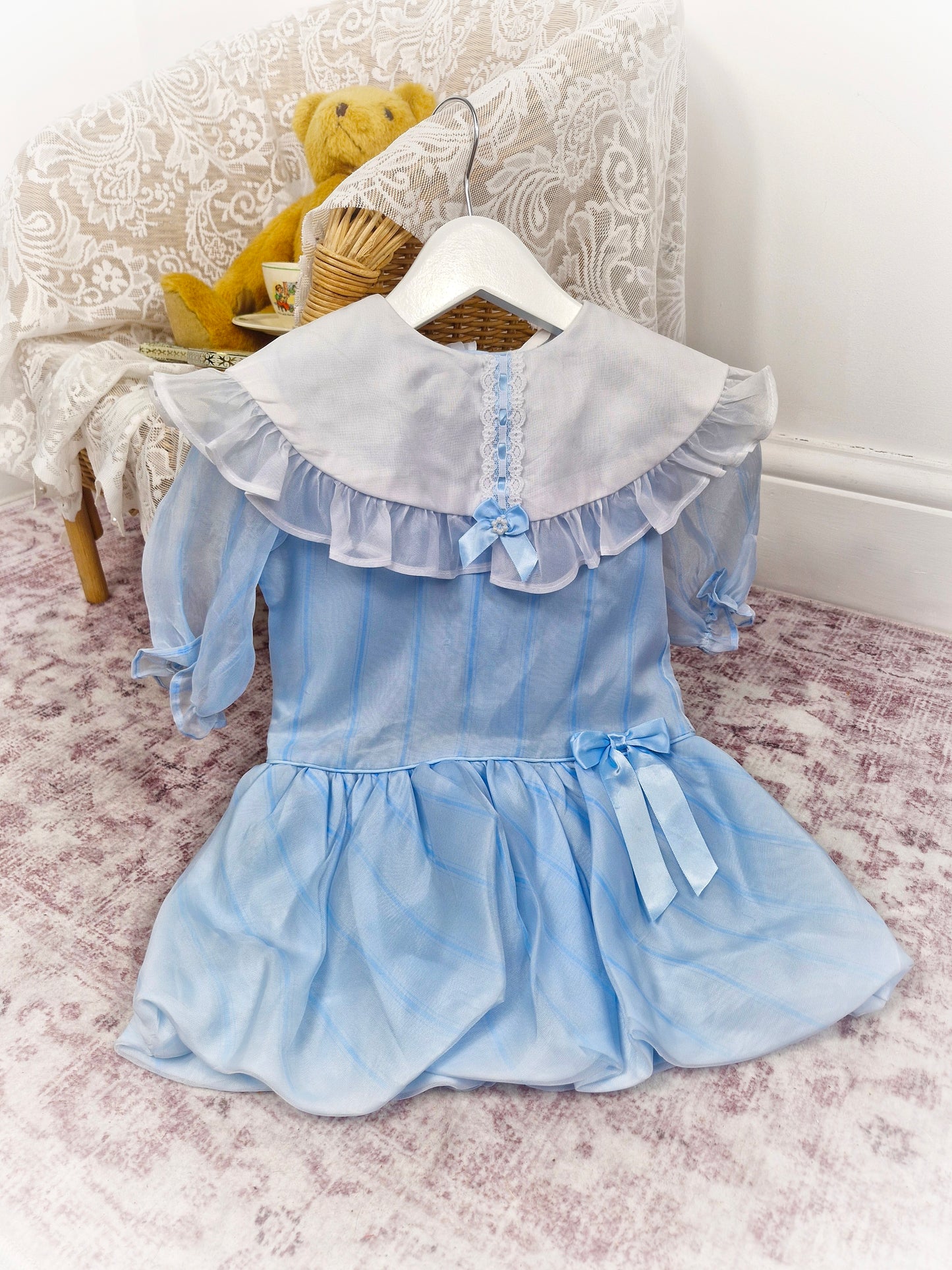 2-3 years. Pale blue striped vintage taffeta dress with white bib, blue ribbon and bubble hem