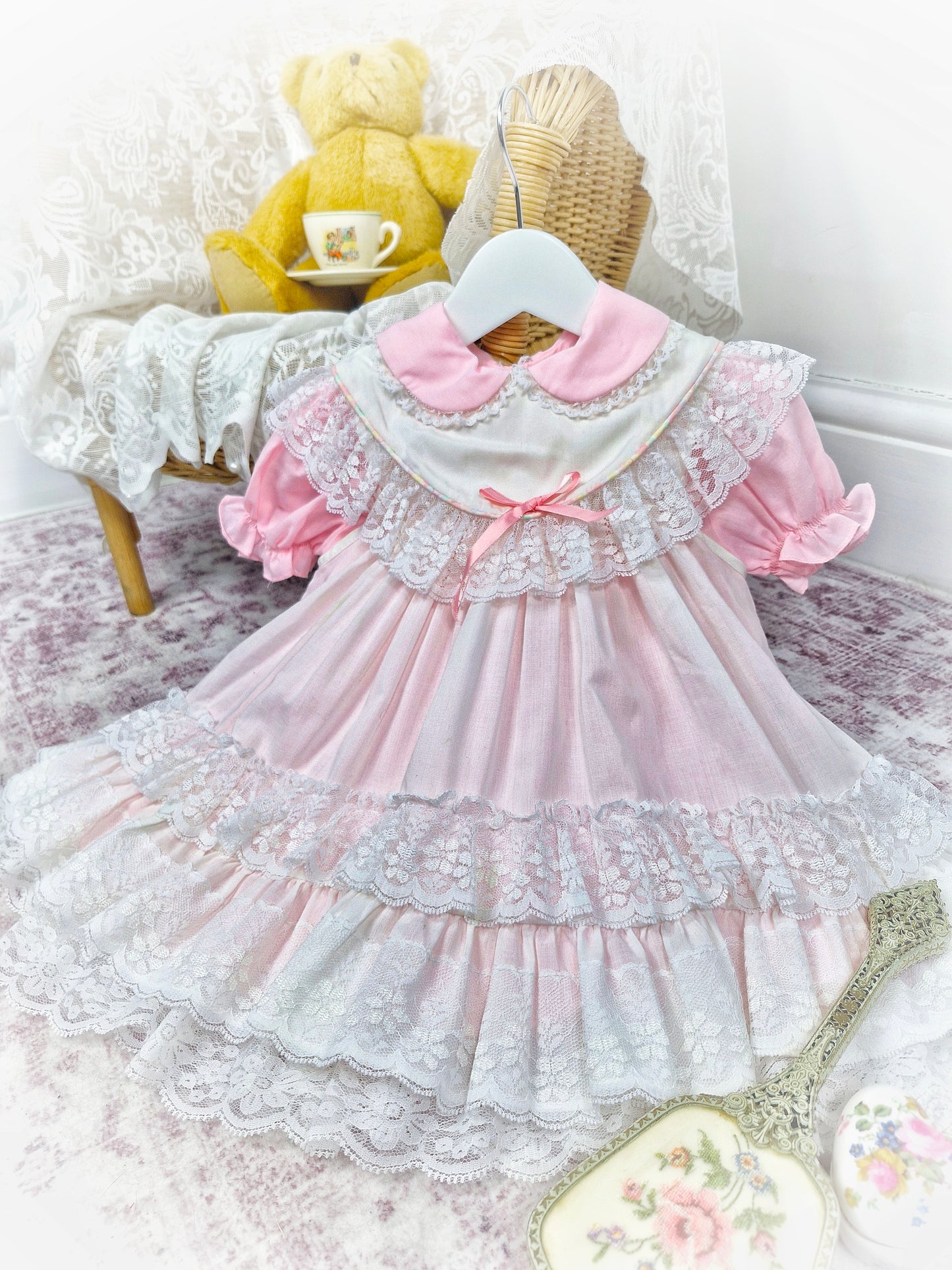 18 months - 2 years. Pink vintage dress with puff sleeves and white apron from Kotton Kandi with lace layers and pink ribbon