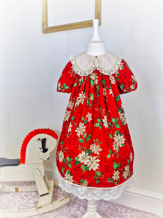 7 years. Red festive vintage dress by Rare Editions. Off white lace hem and bib