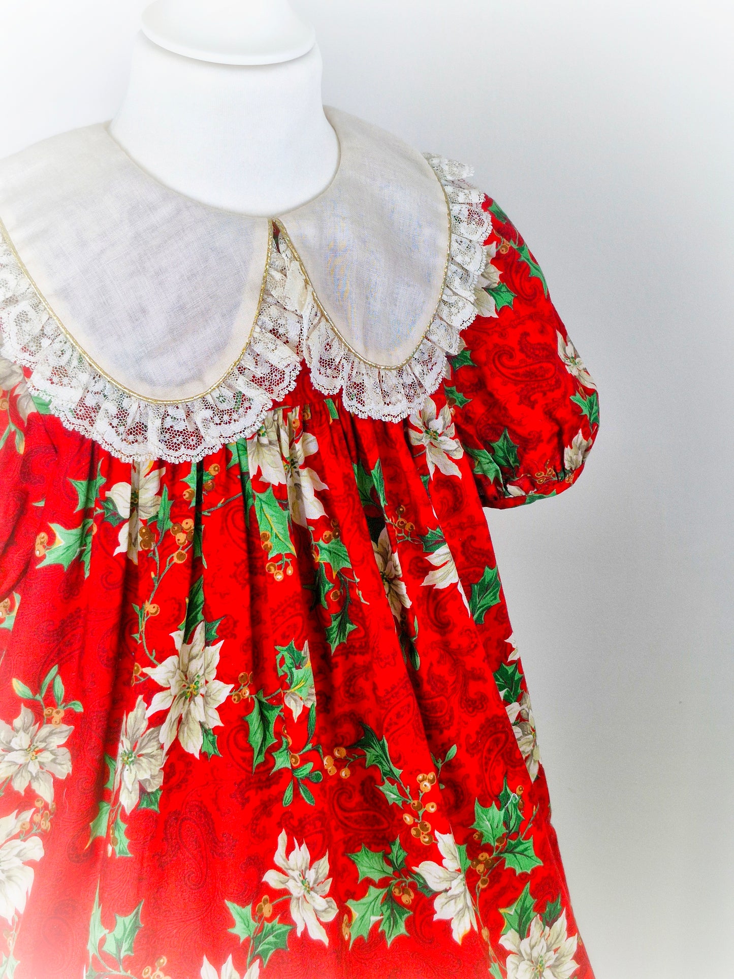 7 years. Red festive vintage dress by Rare Editions. Off white lace hem and bib