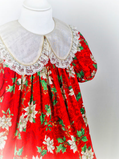 7 years. Red festive vintage dress by Rare Editions. Off white lace hem and bib
