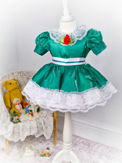 2 years. Green satin dress with white lace and ribbon and red rose. Small pinholes*