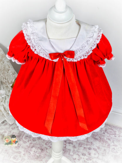 12 months. Red soft velvet vintage dress from Broadway Kids with white lace details and red bow