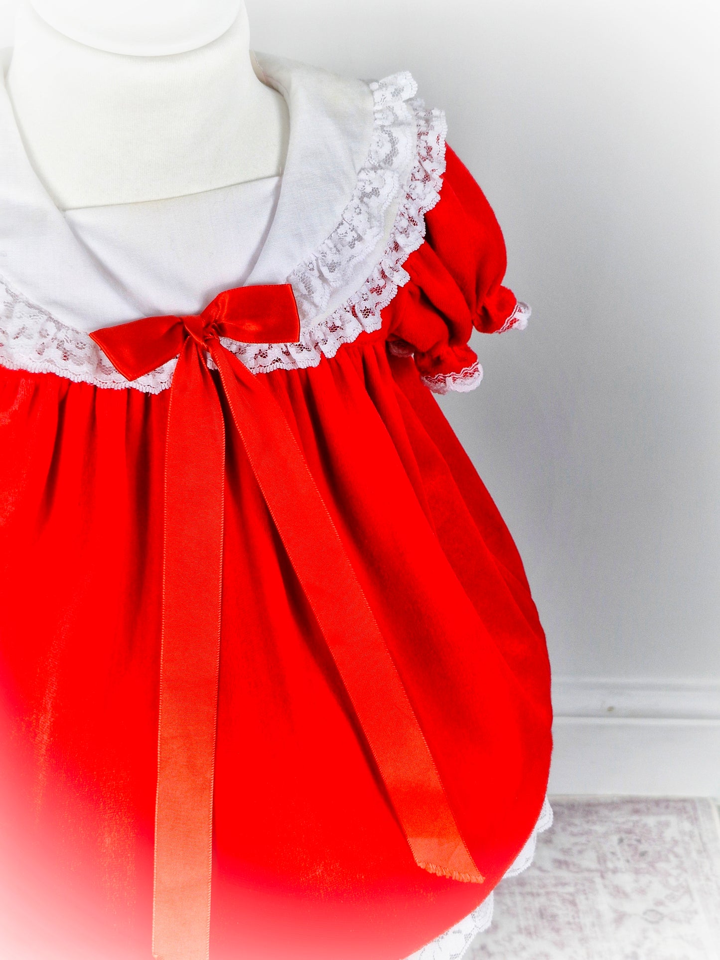 12 months. Red soft velvet vintage dress from Broadway Kids with white lace details and red bow