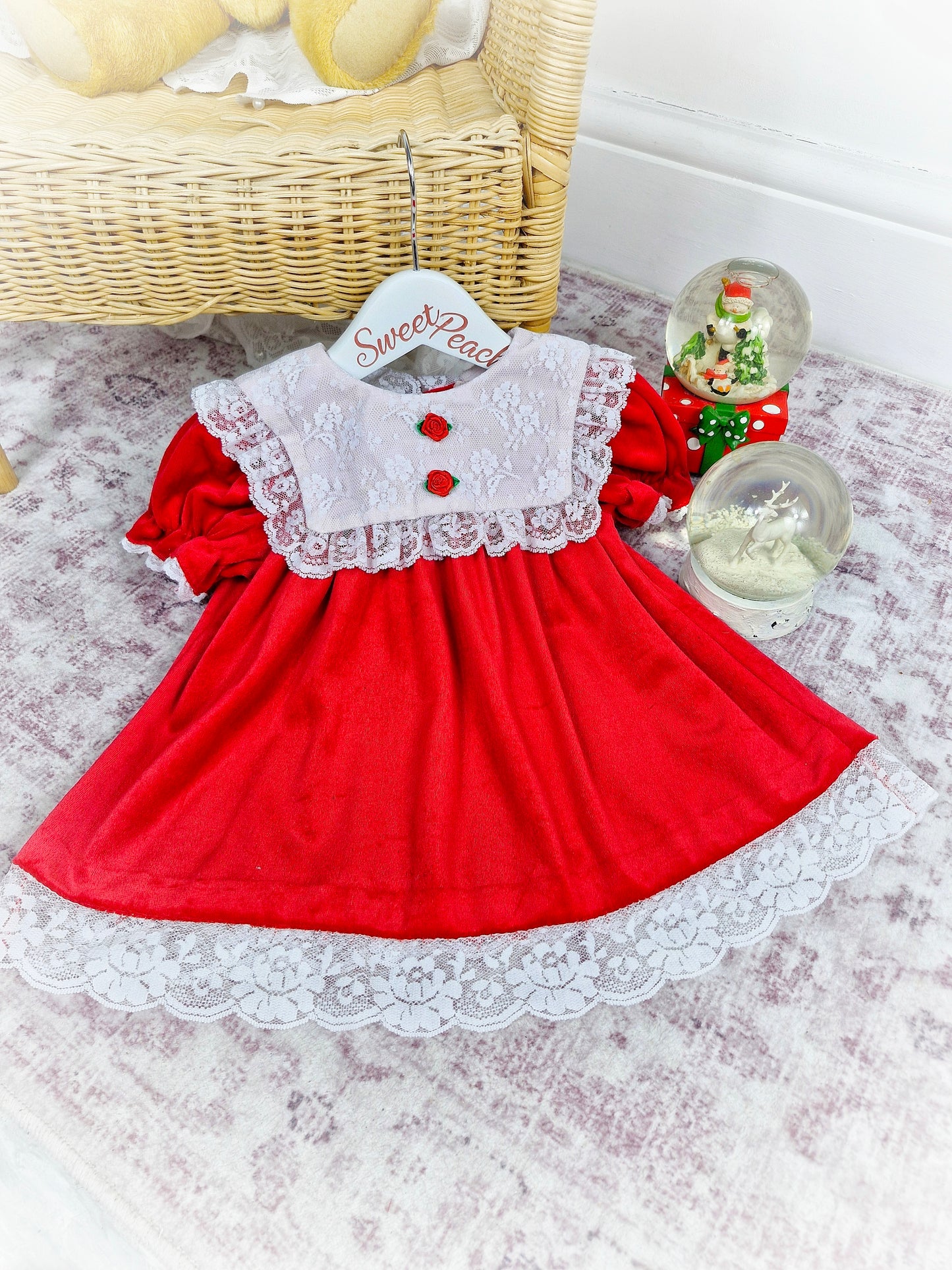 12-18 months. Red soft velvet dress with white lace bib and two rosettes
