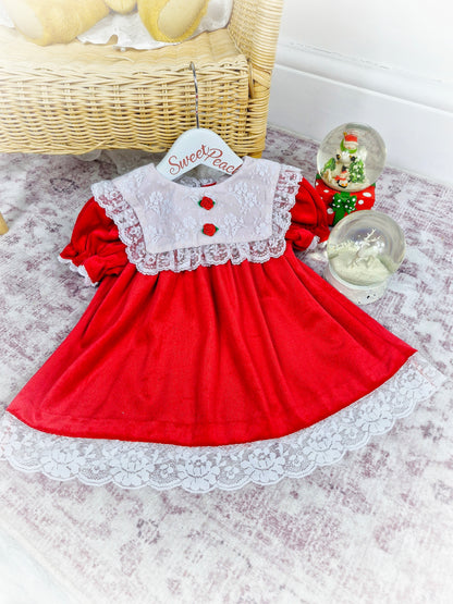 12-18 months. Red soft velvet dress with white lace bib and two rosettes