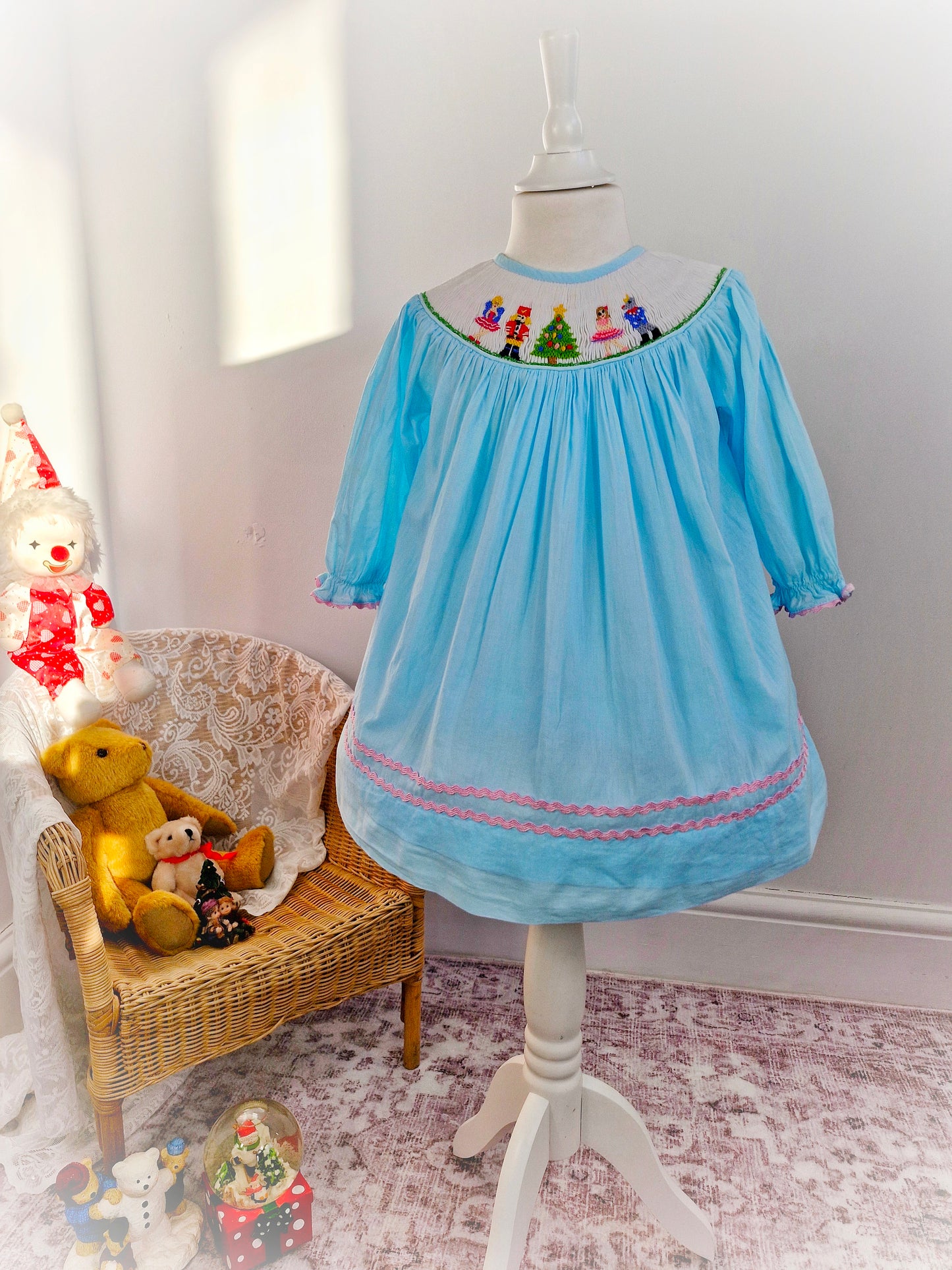 2-3 years. Pale blue smock dress with nutcracker and ballerina embroidered