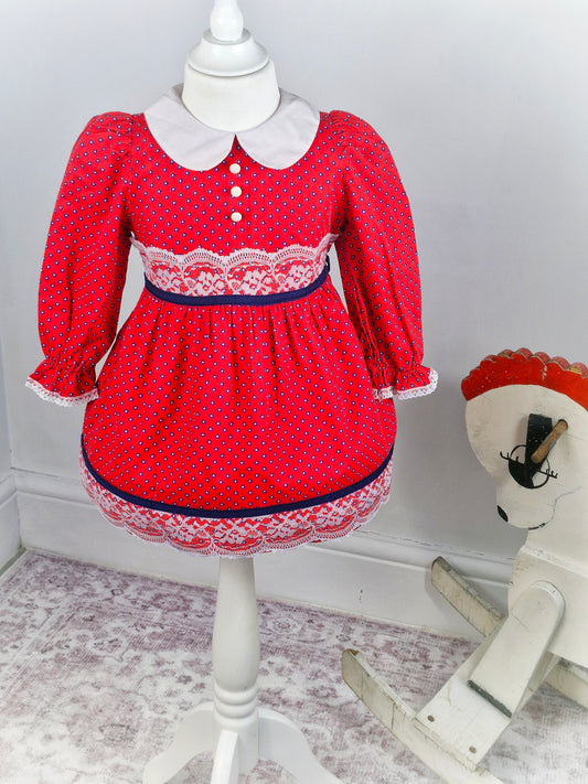 2-3 years. Red vintage dress with navy and white flowers, white collar and lace