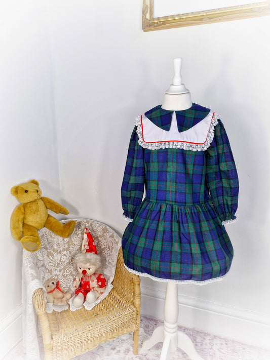 5 years. Navy, green and red tartan vintage dress with white bib by Young St.