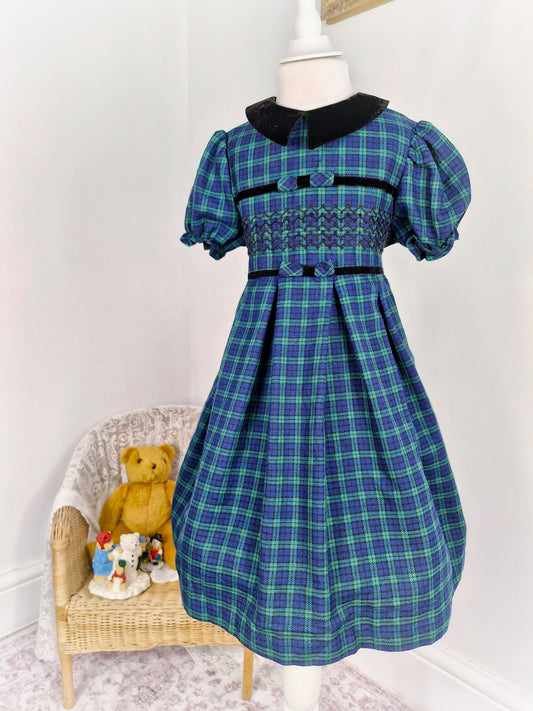 6 years. Bonnie Jean, navy and green tartan dress with black velour collar and smocking