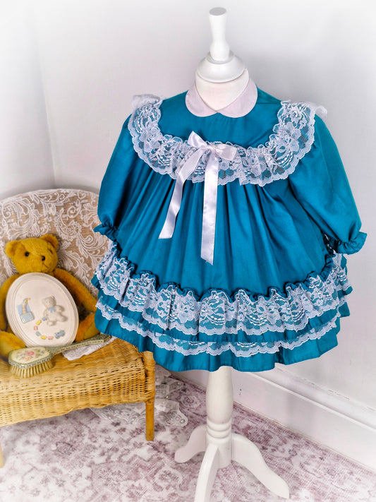 2-3 years. Teal vintage dress by Nicole Scott, white ribbon bow and white lace ruffles