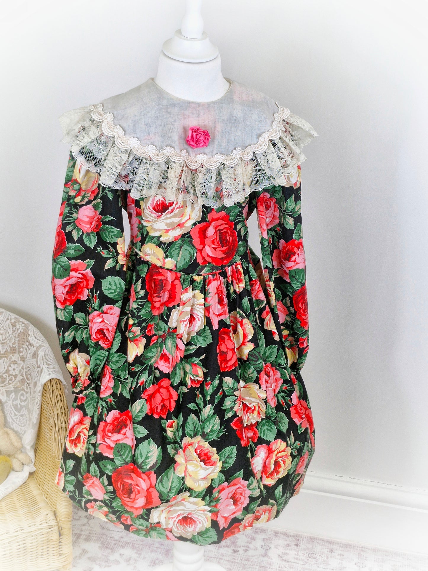 6-7 years. Vintage Peaches n' Cream dress with large floral print, cream bib trimmed with lace