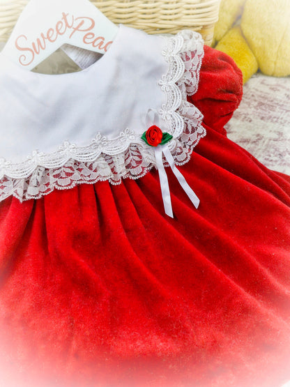 6-9 months. Red velour vintage Bryan dress with white frill bib and red rosette