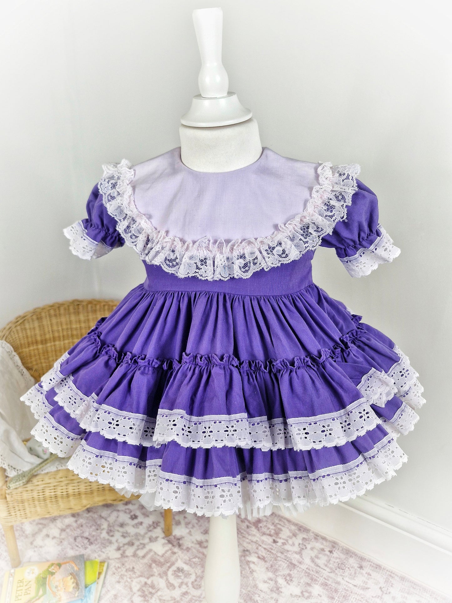 18-24 months/2 years. Purple Lid'l Dolly with white bib and lace trim