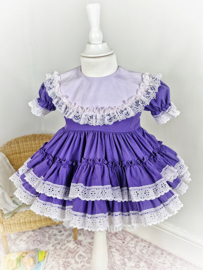 18-24 months/2 years. Purple Lid'l Dolly with white bib and lace trim
