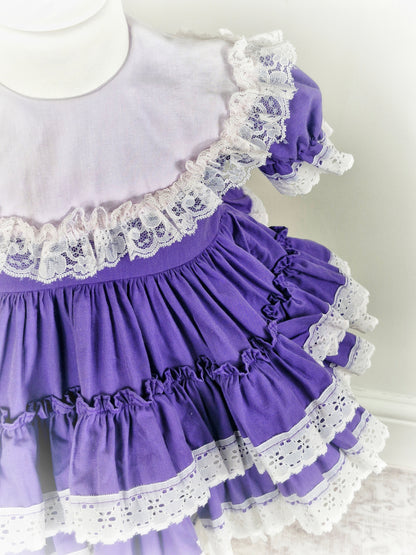 18-24 months/2 years. Purple Lid'l Dolly with white bib and lace trim