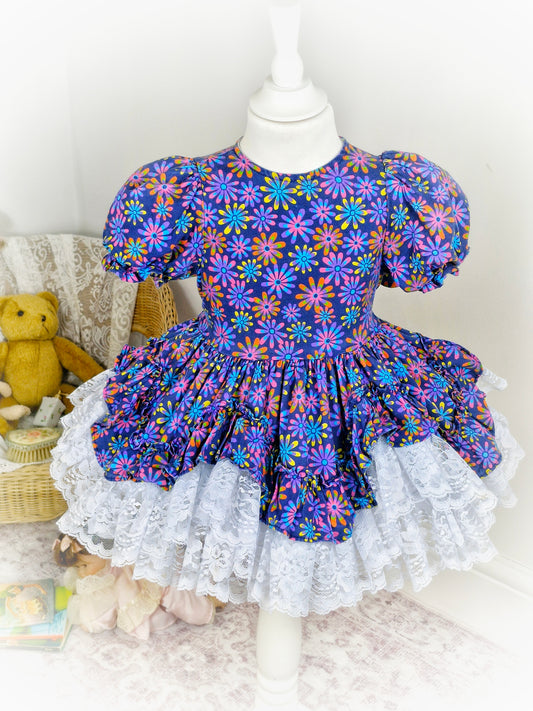 3 years. Navy blue floral Lid'l Dolly with white lace ruffles and puff sleeves