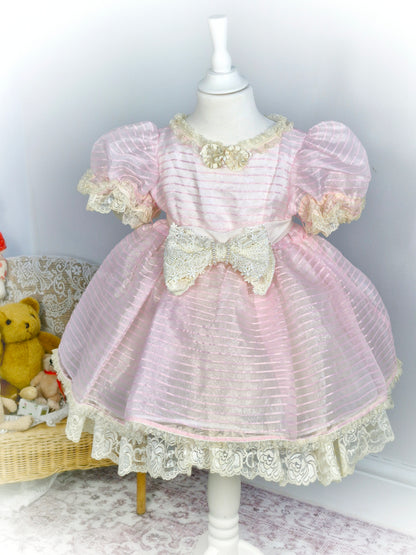 4 years. Soft pink sheer vintage dress with cream lace details and puff sleeves
