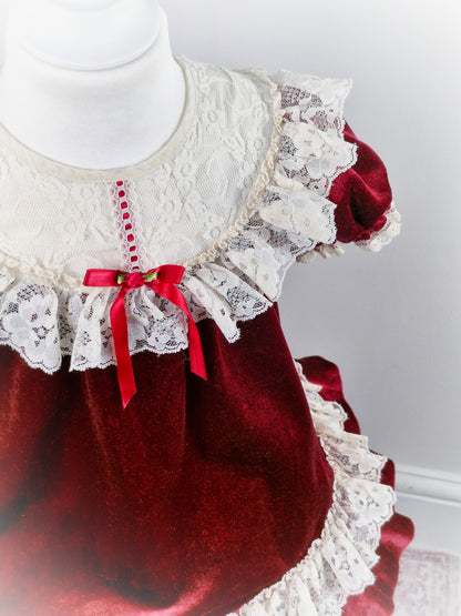 3 years. Vintage burgundy soft velvet dress with white lace bib and trim, red ribbon and rosette