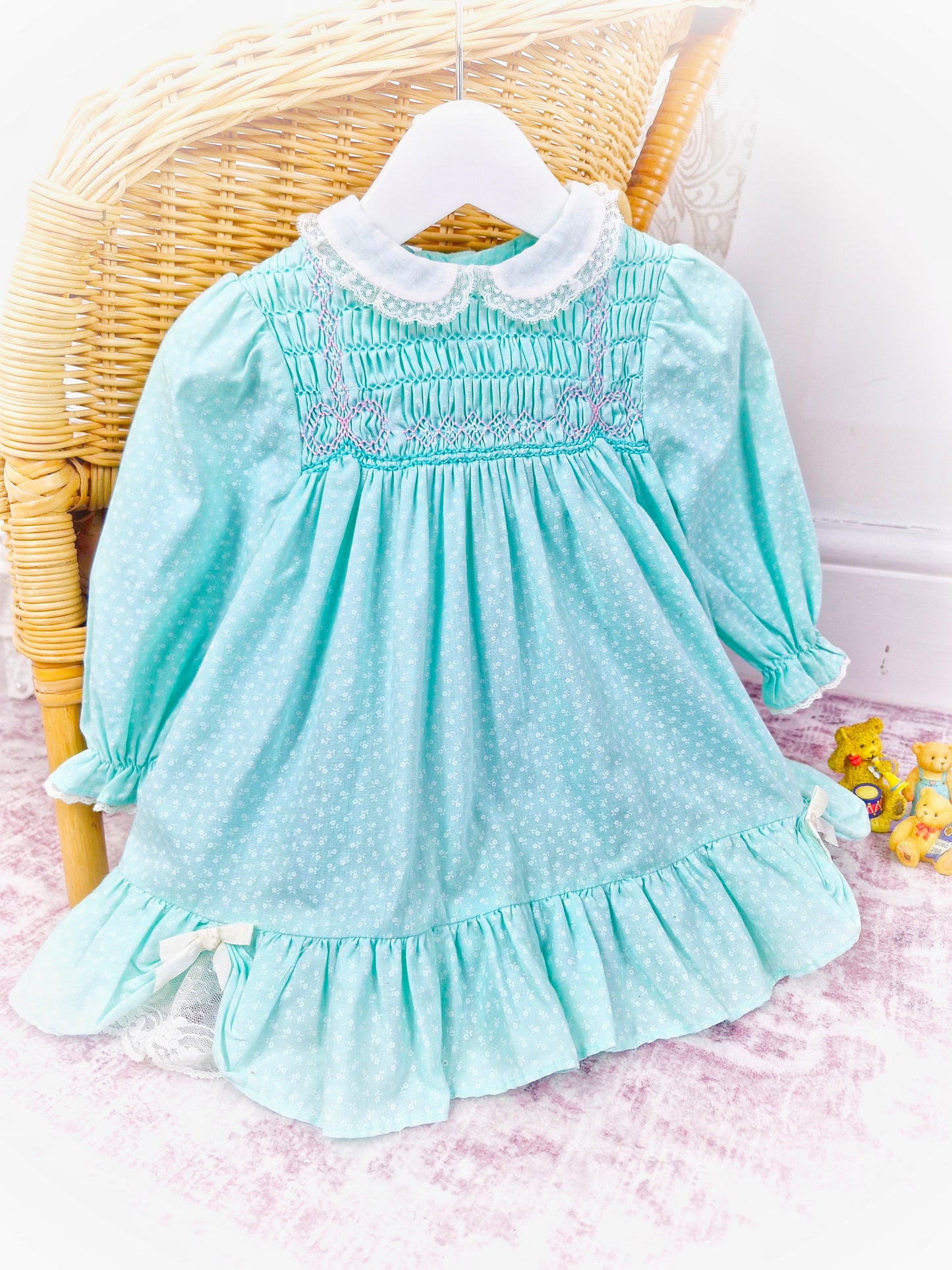 12-18 months. Mint vintage Polly Flinders smock dress with white collar and pink smocking