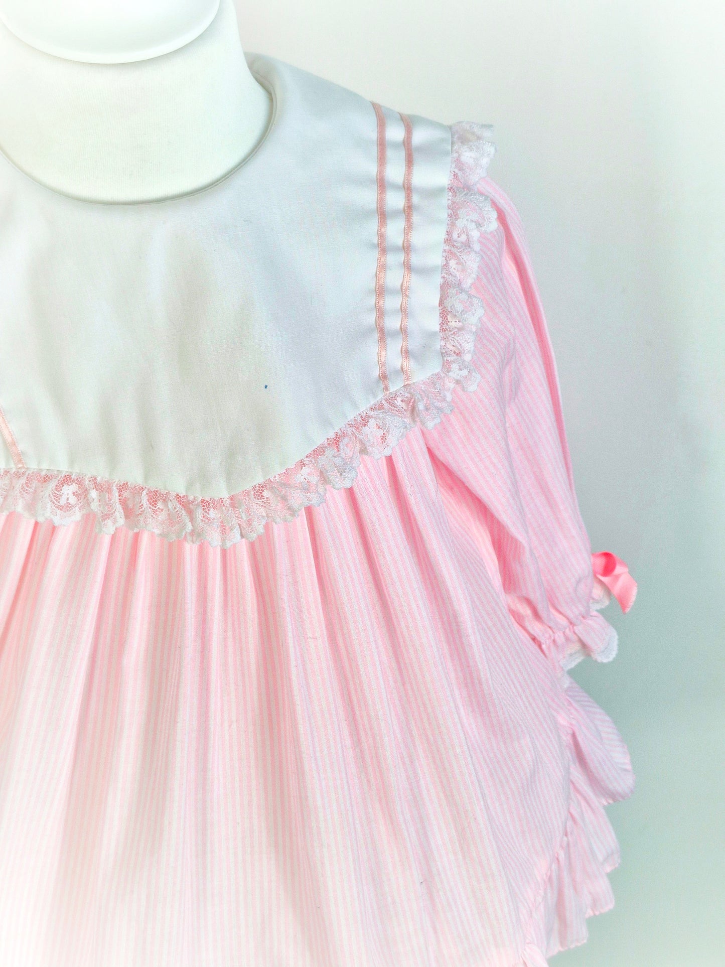 3 years. Pink and white striped vintage dress with large white bib, pink ribbon and lace trim