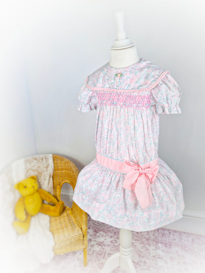 4-5 years. Vintage Polly Flinders drop waist dress with pastel Paisley patterns, pink smocking and large bow