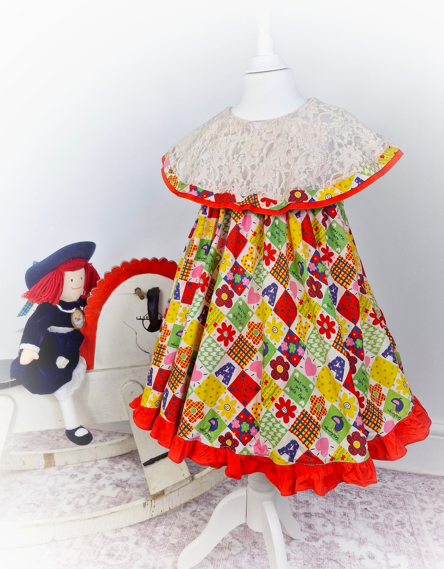 5 years. Vintage inspired patchwork style dress, sleeveless with large lace bib
