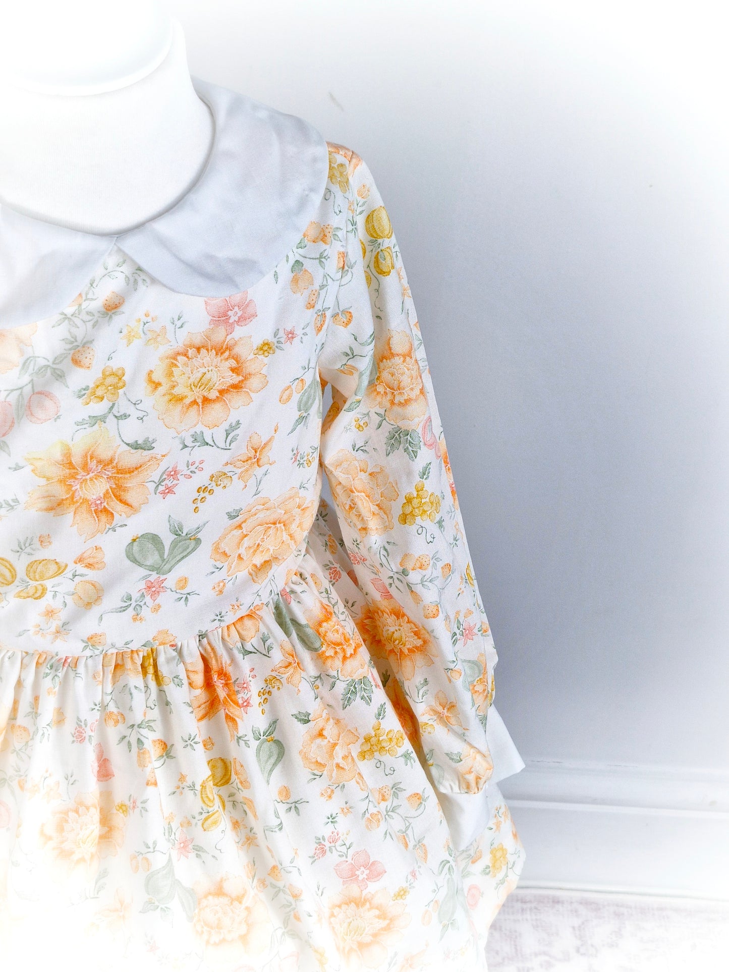 3 years. White Miss Quality dress with orange and peach floral print and Peter Pan collar